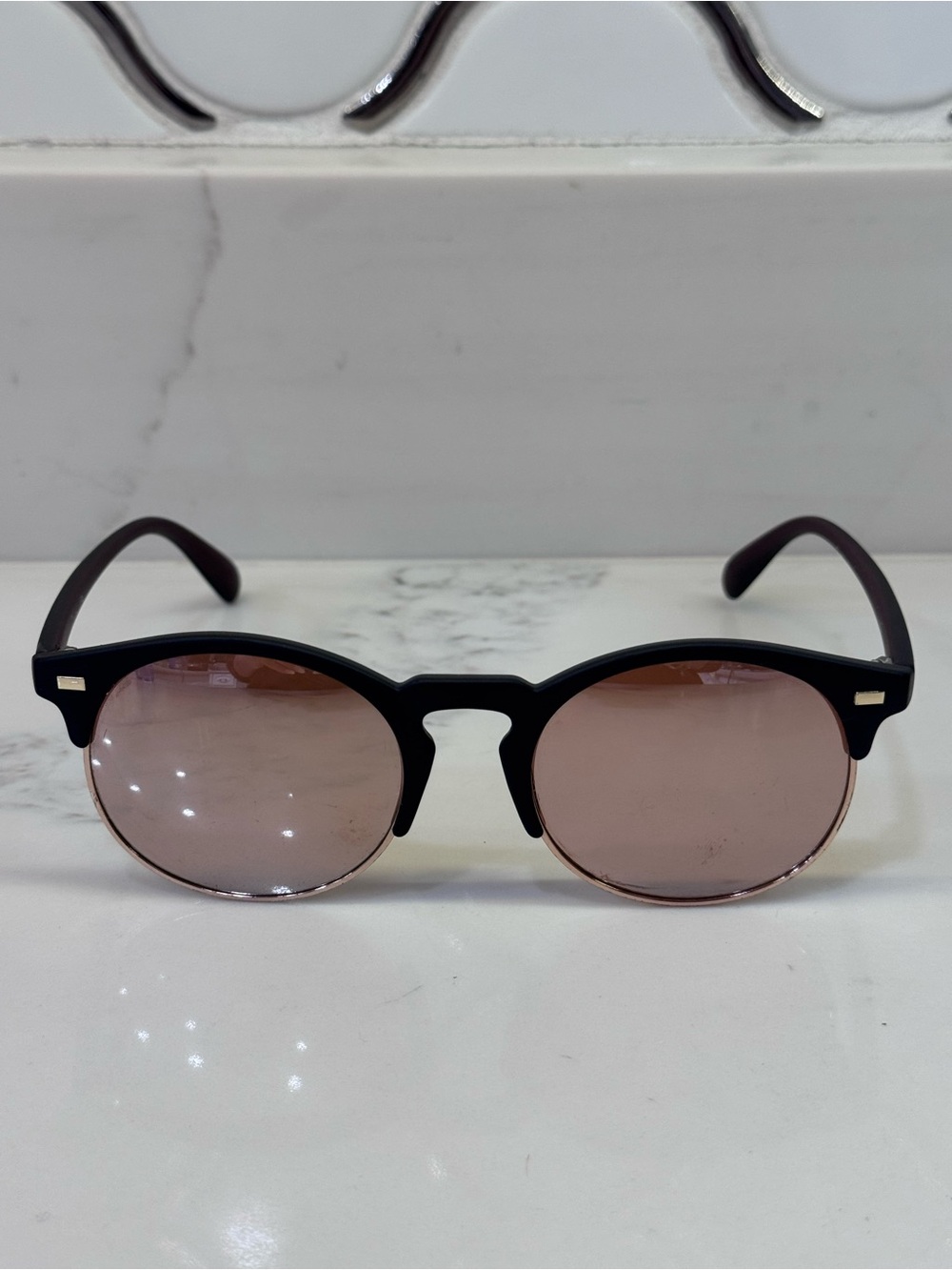 Women’s Round Black Frame Sunglasses with Rose-Tinted Lenses